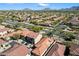 Aerial view of a suburban neighborhood featuring manicured lawns, desert landscaping, and mountain vistas at 7500 E Deer Valley Rd # 38, Scottsdale, AZ 85255