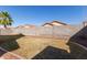 Backyard with low maintenance landscaping, block wall, and clear blue sky at 8134 E Obispo Ave, Mesa, AZ 85212