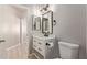Bathroom with modern vanity, framed mirror, and sleek fixtures at 8134 E Obispo Ave, Mesa, AZ 85212