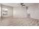 Spacious bedroom featuring neutral walls, wood-look floors, and a ceiling fan at 8134 E Obispo Ave, Mesa, AZ 85212