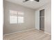 Bedroom featuring light, airy neutral colors and wood-look flooring at 8134 E Obispo Ave, Mesa, AZ 85212