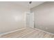 Bright bedroom with wood-look flooring and fresh neutral colors at 8134 E Obispo Ave, Mesa, AZ 85212