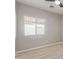 Bedroom with a light neutral paint and light wood-look flooring at 8134 E Obispo Ave, Mesa, AZ 85212