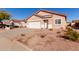 Front exterior of a well maintained home with desert landscaping and an attached two-car garage at 8134 E Obispo Ave, Mesa, AZ 85212