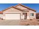 Charming single-story home with a tile roof, two-car garage, and low-maintenance desert landscaping at 8134 E Obispo Ave, Mesa, AZ 85212