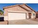 Single-story home with a tile roof, desert landscaping, and a two-car garage at 8134 E Obispo Ave, Mesa, AZ 85212