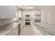 Modern kitchen with stainless appliances, granite countertops, and a center island at 8134 E Obispo Ave, Mesa, AZ 85212