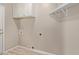 Laundry room with bright neutral paint and vinyl flooring at 8134 E Obispo Ave, Mesa, AZ 85212