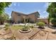 Expansive backyard featuring patio, pergola, garden, and a large two-story home at 8534 W Salter Dr, Peoria, AZ 85382