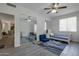 Bedroom featuring carpet, ceiling fan, and full-length mirror at 8534 W Salter Dr, Peoria, AZ 85382