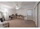 Spacious carpeted spare bedroom with ample storage and a door to the outside at 8534 W Salter Dr, Peoria, AZ 85382