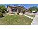 Attractive home with a manicured front lawn, desert landscaping, and a welcoming walkway at 8534 W Salter Dr, Peoria, AZ 85382