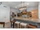 Bright kitchen with large center island, stainless steel appliances, and wood cabinets offers ample storage at 8534 W Salter Dr, Peoria, AZ 85382