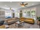 Bright, open living area with large windows, neutral decor, and comfortable seating at 8534 W Salter Dr, Peoria, AZ 85382