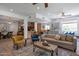 Inviting living room with an open layout, a kitchen view, and stylish furnishings at 8534 W Salter Dr, Peoria, AZ 85382