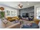 Comfortable living room featuring modern decor, a cozy seating arrangement, and plenty of light at 8534 W Salter Dr, Peoria, AZ 85382