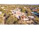 Desert home with red tile roof and lush desert landscaping around the property at 9200 E Whitethorn Cir # 601, Scottsdale, AZ 85266