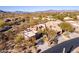 Expansive aerial view of a luxury home, nestled in a desert landscape, and a mountain view at 9200 E Whitethorn Cir # 601, Scottsdale, AZ 85266