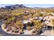 Beautiful aerial shot of a residential property featuring desert landscaping and breathtaking mountain views at 9200 E Whitethorn Cir # 601, Scottsdale, AZ 85266