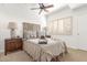 Cozy bedroom with natural light, carpeted floors, and ceiling fan at 9200 E Whitethorn Cir # 601, Scottsdale, AZ 85266