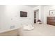 Bright bedroom features a tv and carpeted floors at 9200 E Whitethorn Cir # 601, Scottsdale, AZ 85266