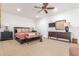 Well-lit bedroom with comfortable furnishings, ceiling fan, and neutral decor at 9200 E Whitethorn Cir # 601, Scottsdale, AZ 85266