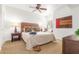 Bright bedroom features a ceiling fan, window seat, and carpeted floors at 9200 E Whitethorn Cir # 601, Scottsdale, AZ 85266
