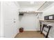 Spacious walk-in closet with shelving, hanging rods, safe, and carpeted floor at 9200 E Whitethorn Cir # 601, Scottsdale, AZ 85266