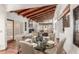 Comfortable dining area situated near the living room with seating for six and terracotta tile flooring at 9200 E Whitethorn Cir # 601, Scottsdale, AZ 85266