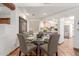 Comfortable dining area situated near the kitchen with natural light and a glass table at 9200 E Whitethorn Cir # 601, Scottsdale, AZ 85266