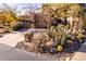 Beautiful home exterior featuring desert landscape and a circular driveway, perfect for curb appeal at 9200 E Whitethorn Cir # 601, Scottsdale, AZ 85266