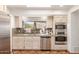 Bright kitchen featuring stainless steel appliances, granite countertops, and view to the backyard at 9200 E Whitethorn Cir # 601, Scottsdale, AZ 85266