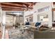 Spacious living room with large windows, comfortable seating, and decorative rug at 9200 E Whitethorn Cir # 601, Scottsdale, AZ 85266