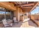 Inviting covered patio with comfortable seating area to enjoy outdoor living at 9200 E Whitethorn Cir # 601, Scottsdale, AZ 85266
