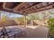 Outdoor patio featuring lounge chairs with an intricate pergola shading, excellent for relaxation at 9200 E Whitethorn Cir # 601, Scottsdale, AZ 85266