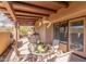 Cozy covered patio with outdoor dining set and built-in BBQ, perfect for entertaining at 9200 E Whitethorn Cir # 601, Scottsdale, AZ 85266