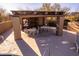 Poolside patio with ample seating, towel storage, and nearby desert scenery at 9200 E Whitethorn Cir # 601, Scottsdale, AZ 85266