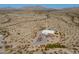 Breathtaking aerial perspective highlighting the secluded property surrounded by the vast, arid desert landscape at 10020 W Tortalita Way, Casa Grande, AZ 85194