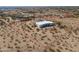 Expansive desert property featuring a modern home with a stucco exterior and a defined property line at 10020 W Tortalita Way, Casa Grande, AZ 85194