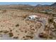 Aerial view of the property showcasing the home's location, desert landscape, and lot boundaries at 10020 W Tortalita Way, Casa Grande, AZ 85194