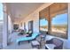 This home features a large covered porch area with seating, loungers, and great desert views at 10020 W Tortalita Way, Casa Grande, AZ 85194