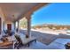 Covered porch and seating with great views of the desert landscape and mountains at 10020 W Tortalita Way, Casa Grande, AZ 85194