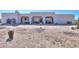 The backyard provides an unobstructed view of the desert landscape and features a covered outdoor seating area at 10020 W Tortalita Way, Casa Grande, AZ 85194
