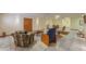 Finished basement features a seating area, neutral tile flooring, and a versatile open layout at 10020 W Tortalita Way, Casa Grande, AZ 85194