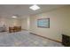 Finished basement featuring neutral-toned walls, tile flooring, a ceiling fan, and dining area at 10020 W Tortalita Way, Casa Grande, AZ 85194