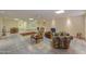 The finished basement offers neutral tile flooring, an open layout with dining and seating areas, and recessed lighting at 10020 W Tortalita Way, Casa Grande, AZ 85194