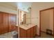 A spacious bathroom with a double vanity, large mirror, and access to a walk-in closet at 10020 W Tortalita Way, Casa Grande, AZ 85194