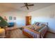 Comfortable bedroom featuring a patterned quilt and natural light at 10020 W Tortalita Way, Casa Grande, AZ 85194