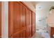 Large wooden closet door in bathroom with view to walk-in shower at 10020 W Tortalita Way, Casa Grande, AZ 85194