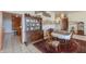 Dining room with wooden furniture, display cabinet and patterned rug at 10020 W Tortalita Way, Casa Grande, AZ 85194